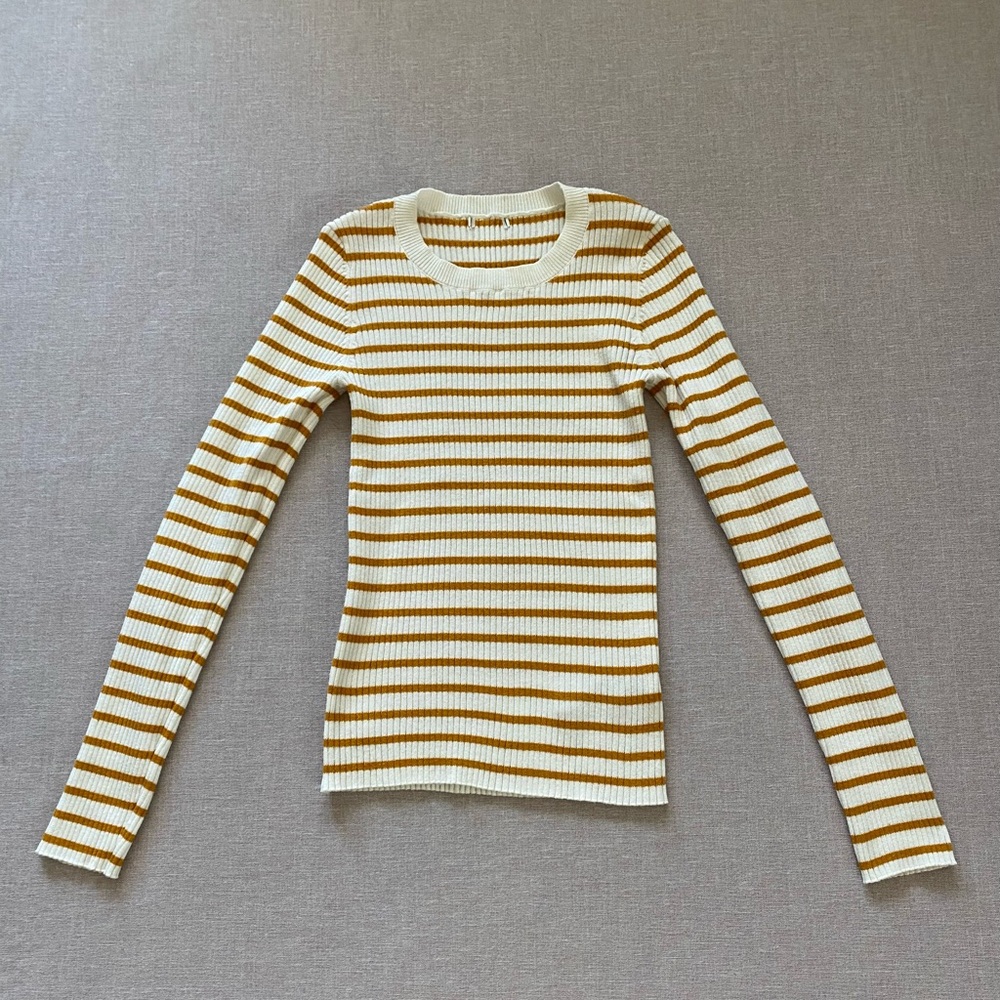 Mustard yellow ribbed knit top.